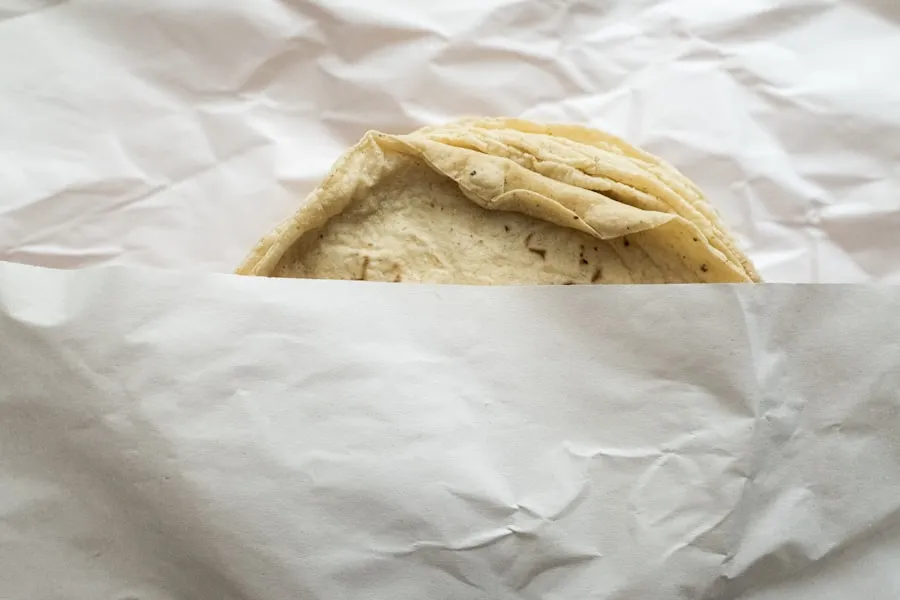 Warm flatbread stacked on the bakery shelf at Cedarview