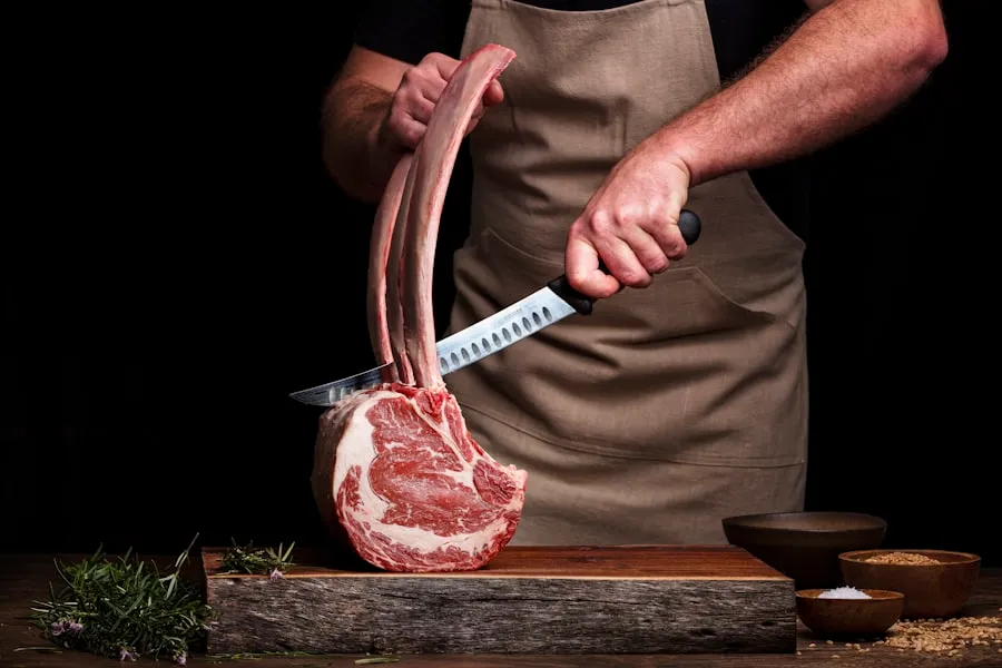 A butcher trimming lamb behind the counter at Cedarview